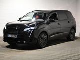 a picture of a black car parked in a garage