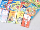 many children ' s books that are sitting on a table