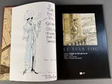 a book with a drawing of a man in a suit