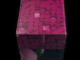 packaging of a pink box with a picture of a cat on it