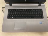 a silver laptop with a black keyboard on a table