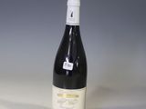 a bottle of wine that is sitting on a table