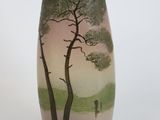a vase that has a painting of a tree on it
