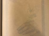 an open book with a drawing of a woman sitting on top of a table