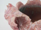 a close up of a piece of meat on a white surface
