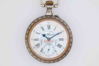 a pocket watch with roman numerals on the face