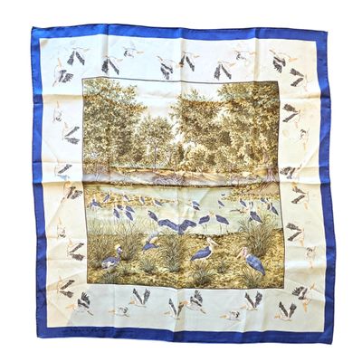 an image of a blue and white scarf with birds
