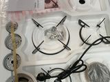 a white stove top with a clock on it in a box