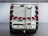 a white van with a ladder on the back of it