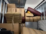 many boxes stacked on top of each other in a moving truck