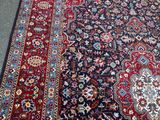an image of a large oriental rug on the floor