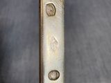 a close up of a metal object with holes in it
