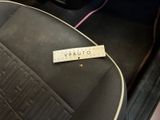 a car seat with a sticker on it that says quality