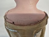 a close up of a mannequin head with a label on it