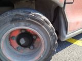 a close up of a flat tire on a truck
