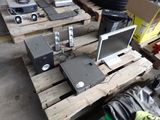 a lot of electronic equipment sitting on a pallet
