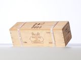a wooden box with a label on it sitting on a table