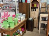 many different colored pots and pans sitting on a table