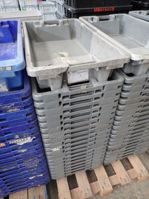 many plastic bins stacked on top of each other