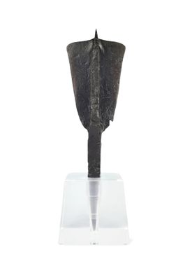 an image of a metal object on a clear stand