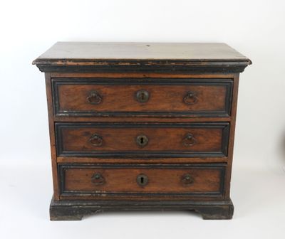 a small wooden chest of drawers on a white background