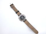 an image of a watch on a white surface with a white background