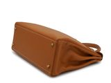 the tan leather bag is open and ready to be used