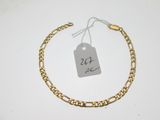 a close up of a gold bracelet with a price tag on it