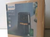 packaging of a philips air fryer sitting on top of a table