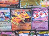 a lot of pokemon cards that are on the table