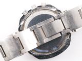 a close up of a watch on a white surface