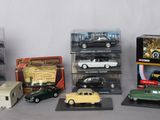 a lot of different model cars in a display case