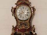 a clock hanging on the wall on the wall
