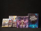 a lot of video games on a black table