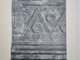 a black and white photo of a book with a drawing on it