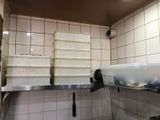 a kitchen with a lot of dishes on the counter