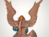 an image of a statue of an angel holding a sword