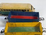 three toy trains that are sitting on a table