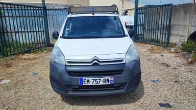 a small white van parked in front of a fence