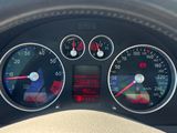 a close up of a car dashboard with various gauges
