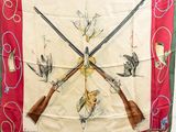 a picture of a scarf with two guns and birds on it