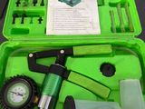 a green case with tools in it sitting on a table