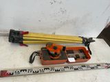 a measuring tape and a level on the floor