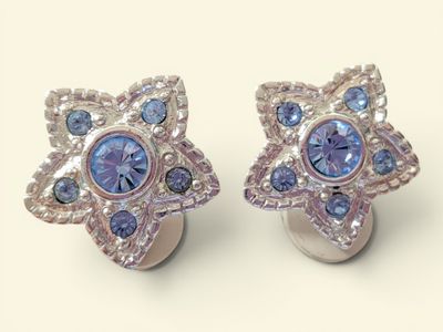 pair of blue and white crystal earrings on a white surface