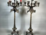 pair of antique brass candelabs with birds on them