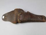 an old leather belt with a metal buckle on a white surface