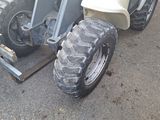 a tractor that is parked on the side of the road