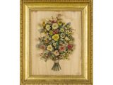 une vieille photo représentant un bouquet de fleurs dans un cadre doré