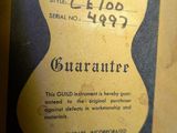 an old guitar label on the back of a guitar case