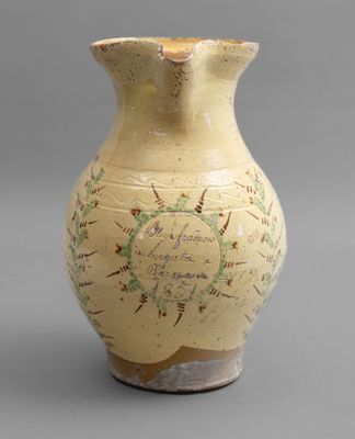 a vase with a map on it sitting on a table